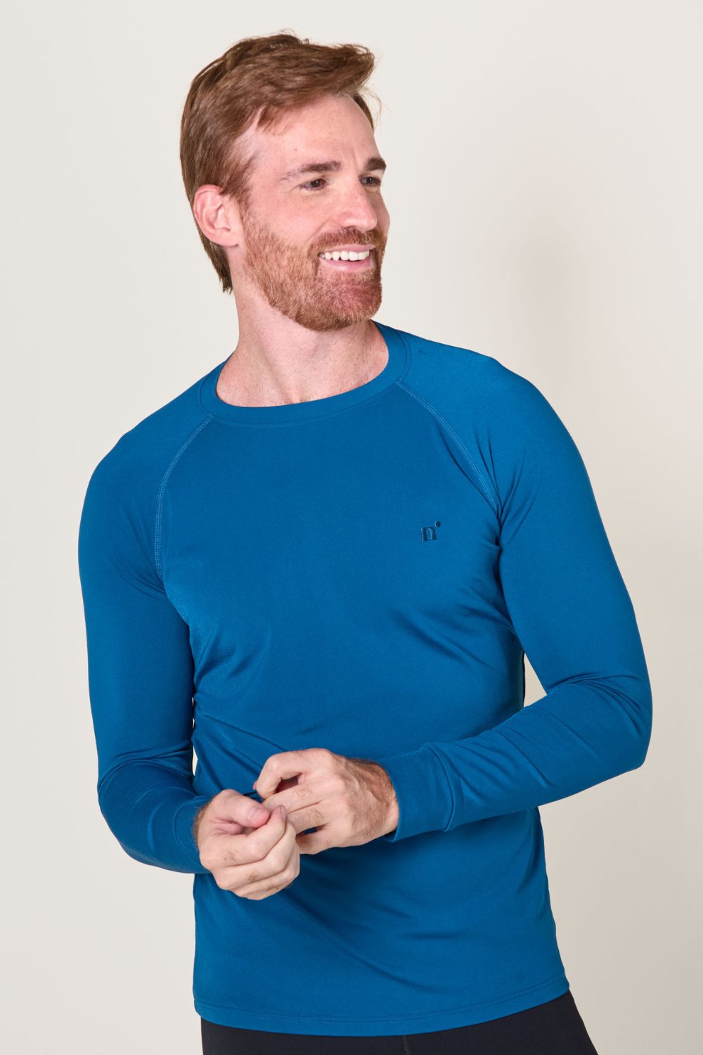 T-shirt de bain anti-UV bleu pour homme, manches longues, protection UPF 50+ et confort optimal.